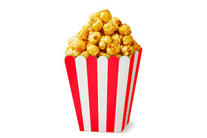Caramel popcorn in a box close-up on