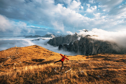 Traveler stands at Tre Cime, a Nature Photo by bortnikauphoto
