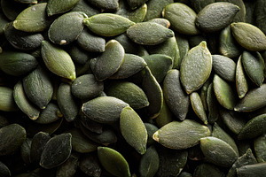 View of a pile of pumpkin seeds, a Photo by Pavel_design
