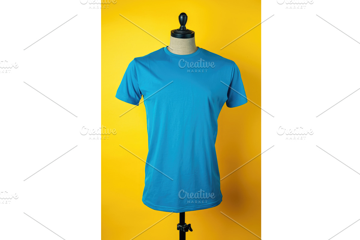 A blue t-shirt on a mannequin on a, an Illustration by tilialucida