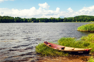 Lonely boat on the lake, a Nature Photo by BOOCYS