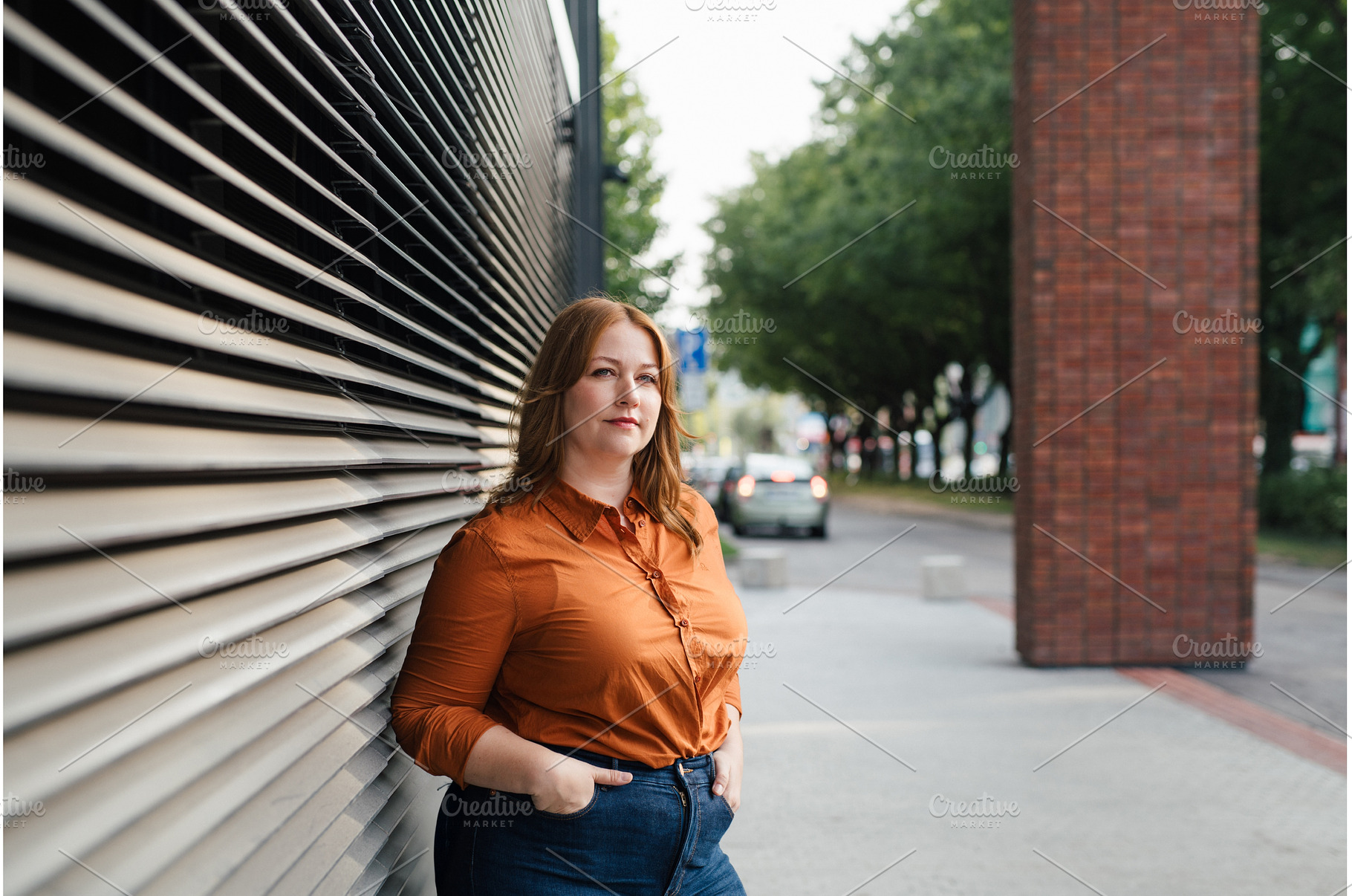 Plus size woman standing outdoors in, a Person Photo by HalfPoint