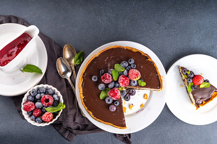 Homemade cheesecake with chocolate and berry, a Food & Drink Photo by Rimma