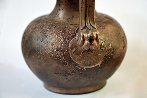 Ancient bronze jug with sculpted, an Architecture Photo by Rohan Photography