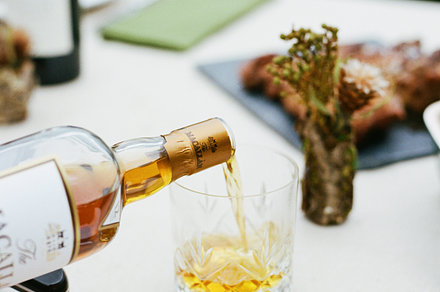 Pouring Scotch at Catered Dinner