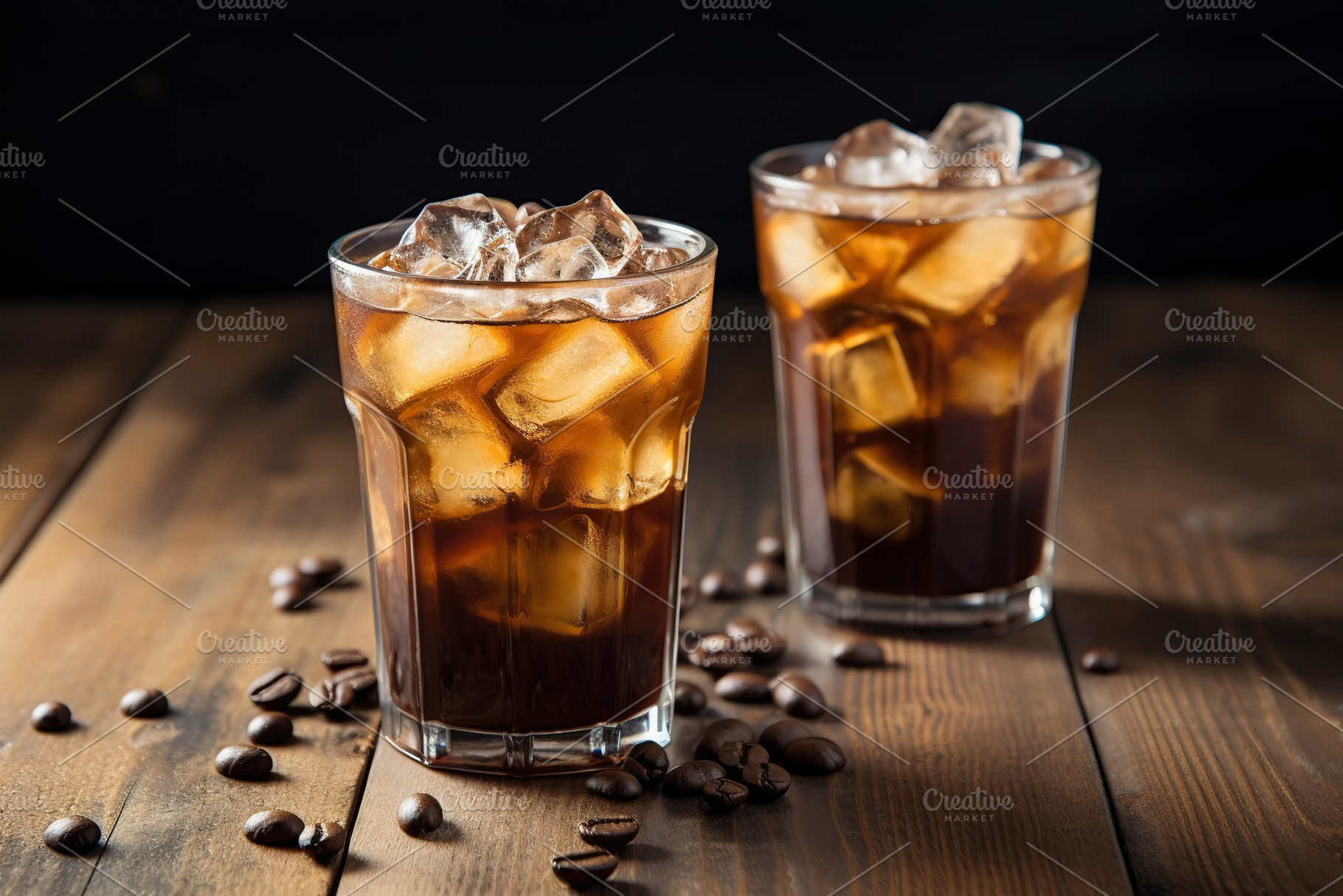 Iced coffee in glasses on wooden background, a Food & Drink Photo by AlyaAnd