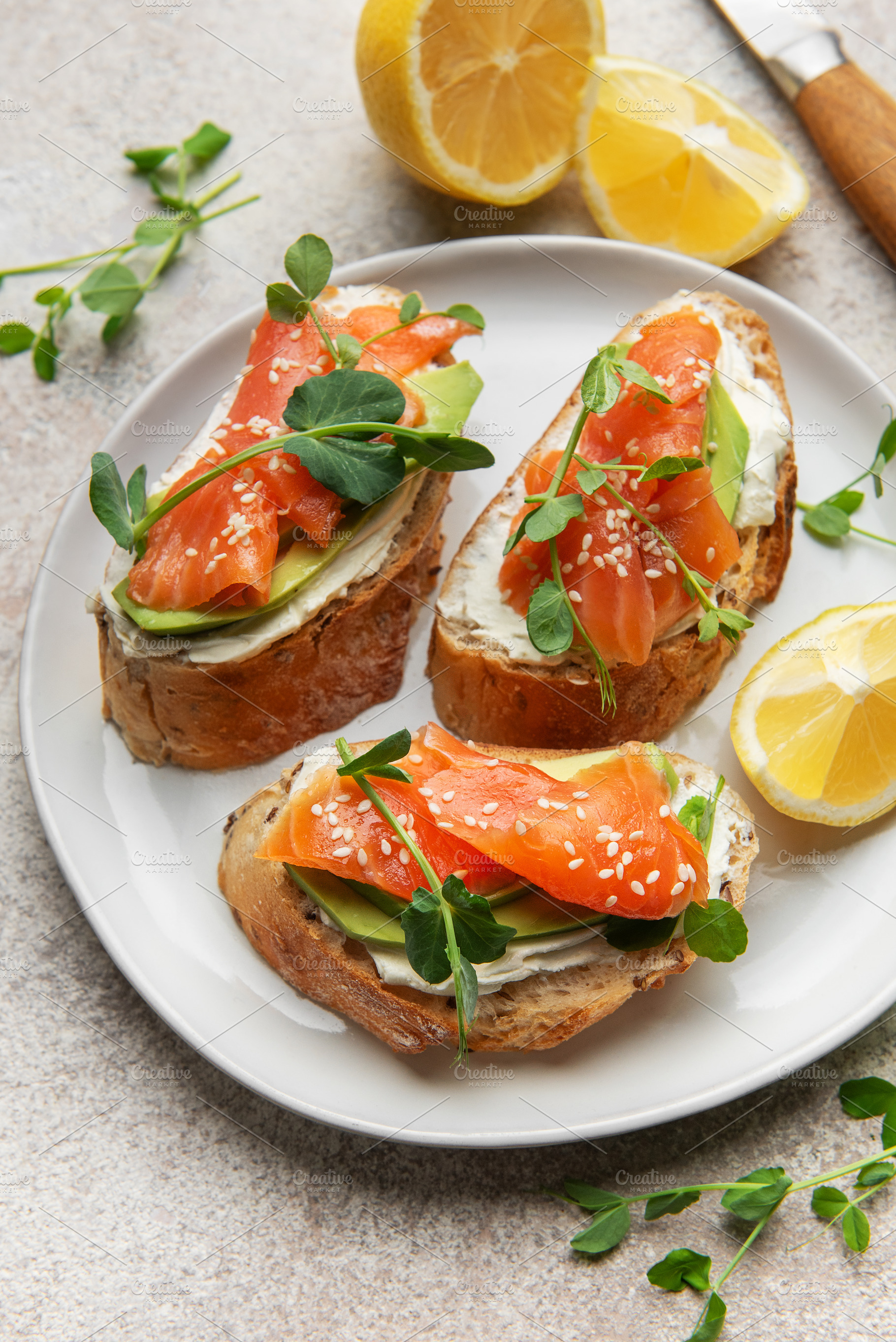 Salmon avocado bruschetta with cream cheese and microgreens, a Food & Drink Photo by Olena Rudo