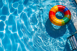 Colorful inflatable ring floating in clear pool, a Sports & Recreation Photo by Davizro's Market