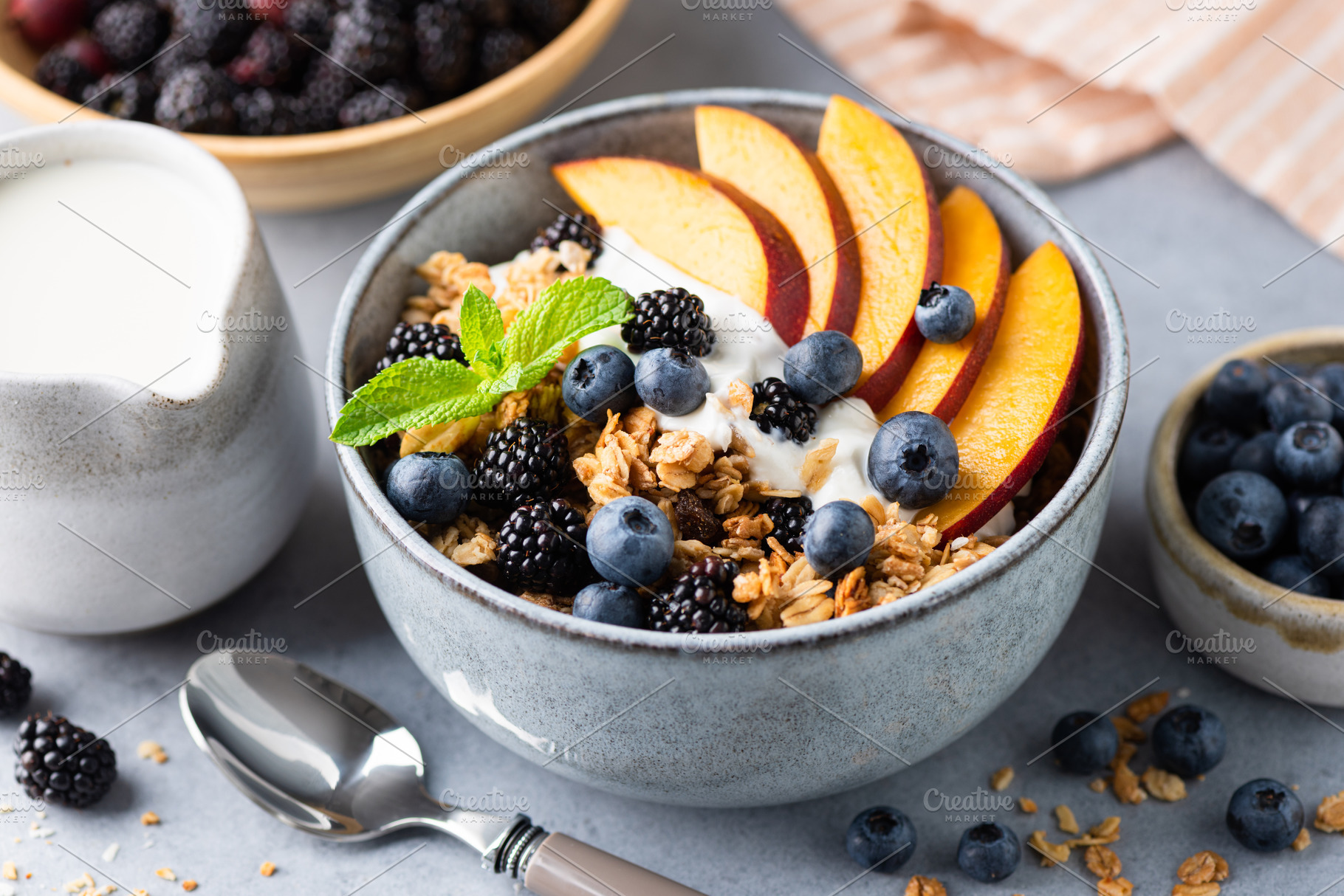 Granola and yogurt bowl with peach, a Food & Drink Photo by The baking man