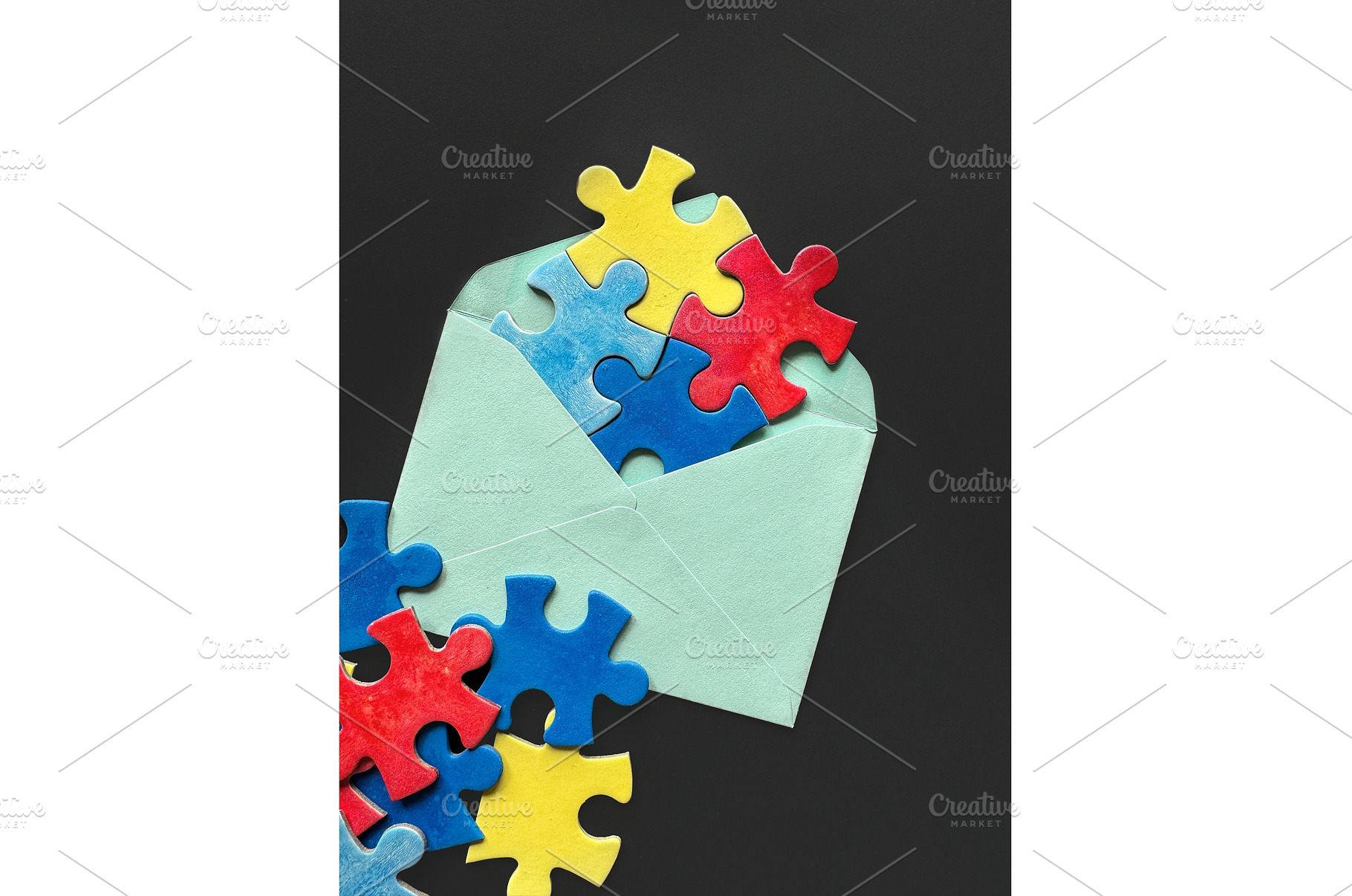 Colorful puzzle pieces spilling out, a Photo by tilialucida