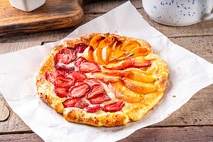 Tasty summer fruit and berry galette open pie, a Food & Drink Photo by Rimma