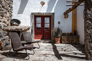 Rustic courtyard with wicker chairs, an Architecture Photo by SkyNext