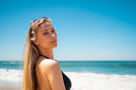 Blond woman on beach, a Person Photo by andreonegin market