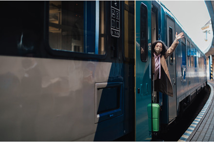 Happy young traveler woman with, a Transportation Photo by HalfPoint