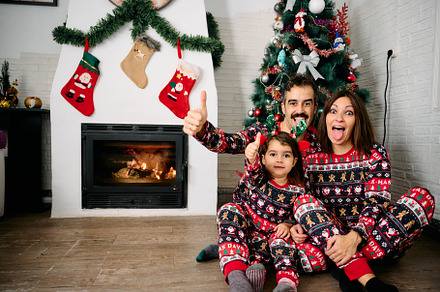 Family wearing matching Christmas pajamas, a Holiday Photo by YossSabalet
