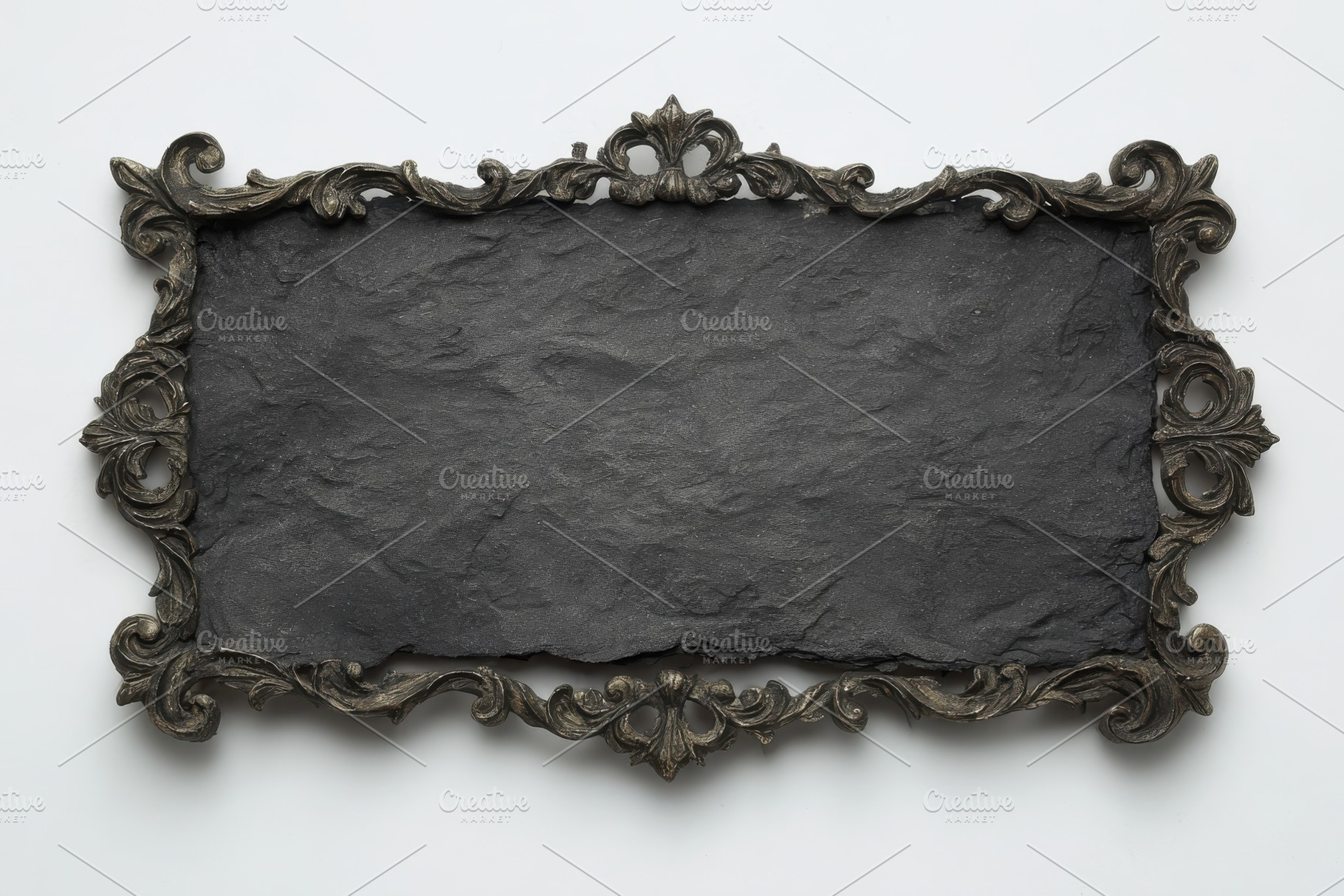 Ornate frame with dark slate sign bl, a Photo by Pixeness Studio