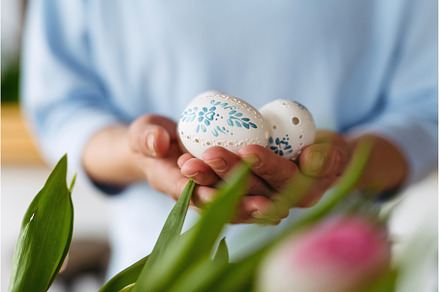 Hands holding decorated Easter eggs, a Holiday Photo by HalfPoint
