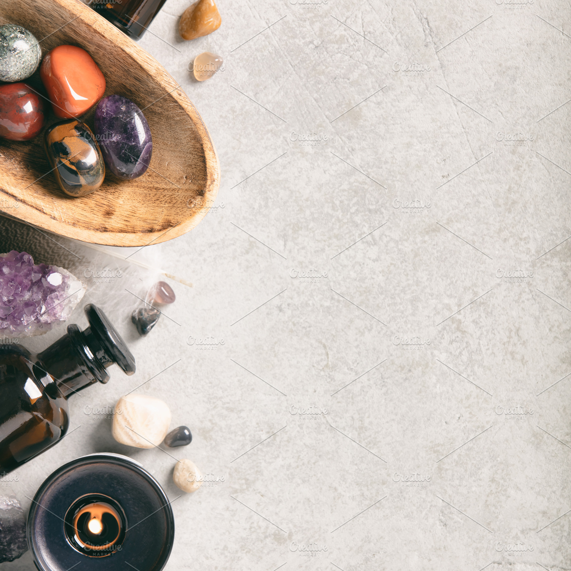 Crystal Healing Stones and Essential Oil Bottles on Gray Backgro, an Abstract Photo by Natalia Klenova's Shop