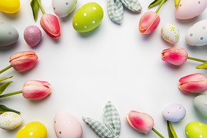 Easter eggs and tulips forming a festive frame, a Holiday Photo by Olena Rudo