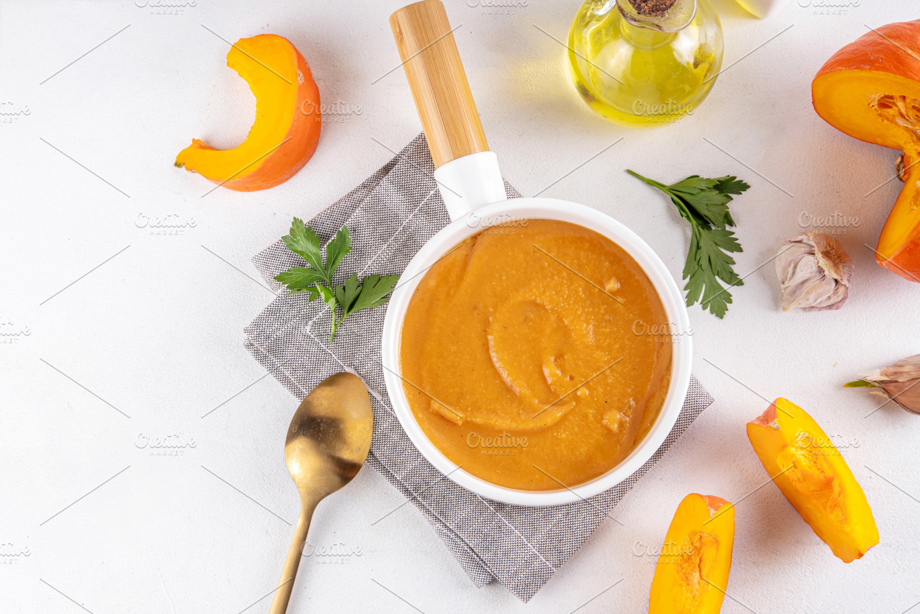 Pumpkin creamy soup served in white bowl, a Food & Drink Photo by Rimma