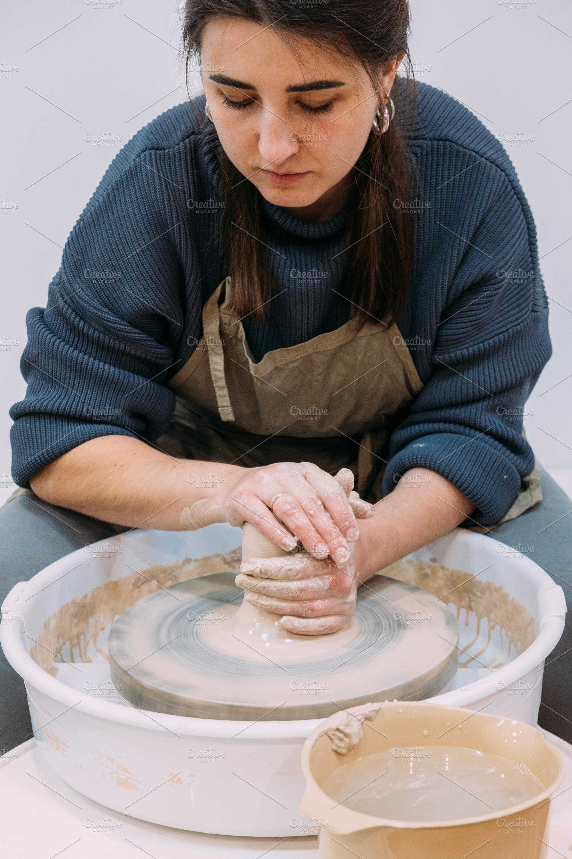 Ceramic artist working pottery manufacturing woman, an Arts & Entertainment Photo by Photo Drive Studio