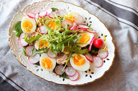 Fresh salad with tuna, radish, eggs, a Food & Drink Photo by Vaivirga