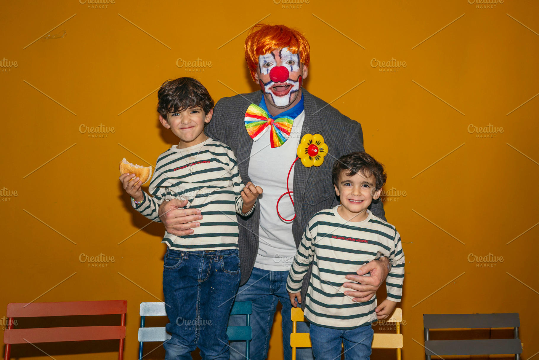 Clown celebrating birthday party with happy children, a Person Photo by karrastock