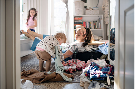 Tired mother with small toddler