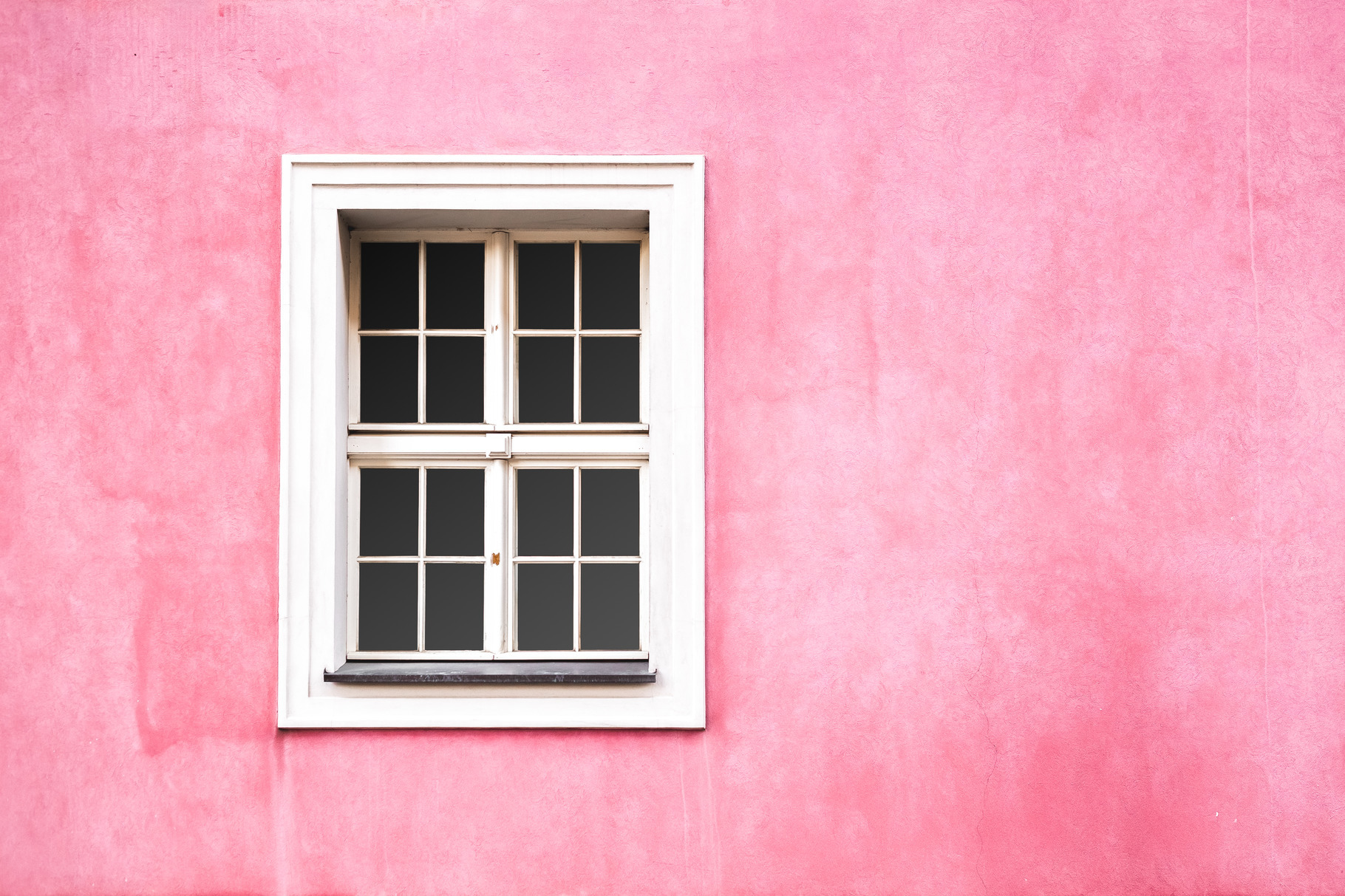 Renaissance window on pink wall, an Architecture Photo by Andriana Syvanych