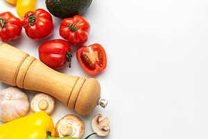 Fresh healthy vegetables for vegan cooking on white background, a Food & Drink Photo by Olena Rudo