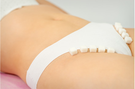 Sugar cubes lying in a row on female, a Person Photo by okskukuruza