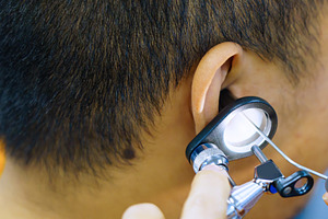 Patient is seen by an otolaryngologist. ENT doctor examines a pa, a Health & Medical Photo by Casanowe-studio