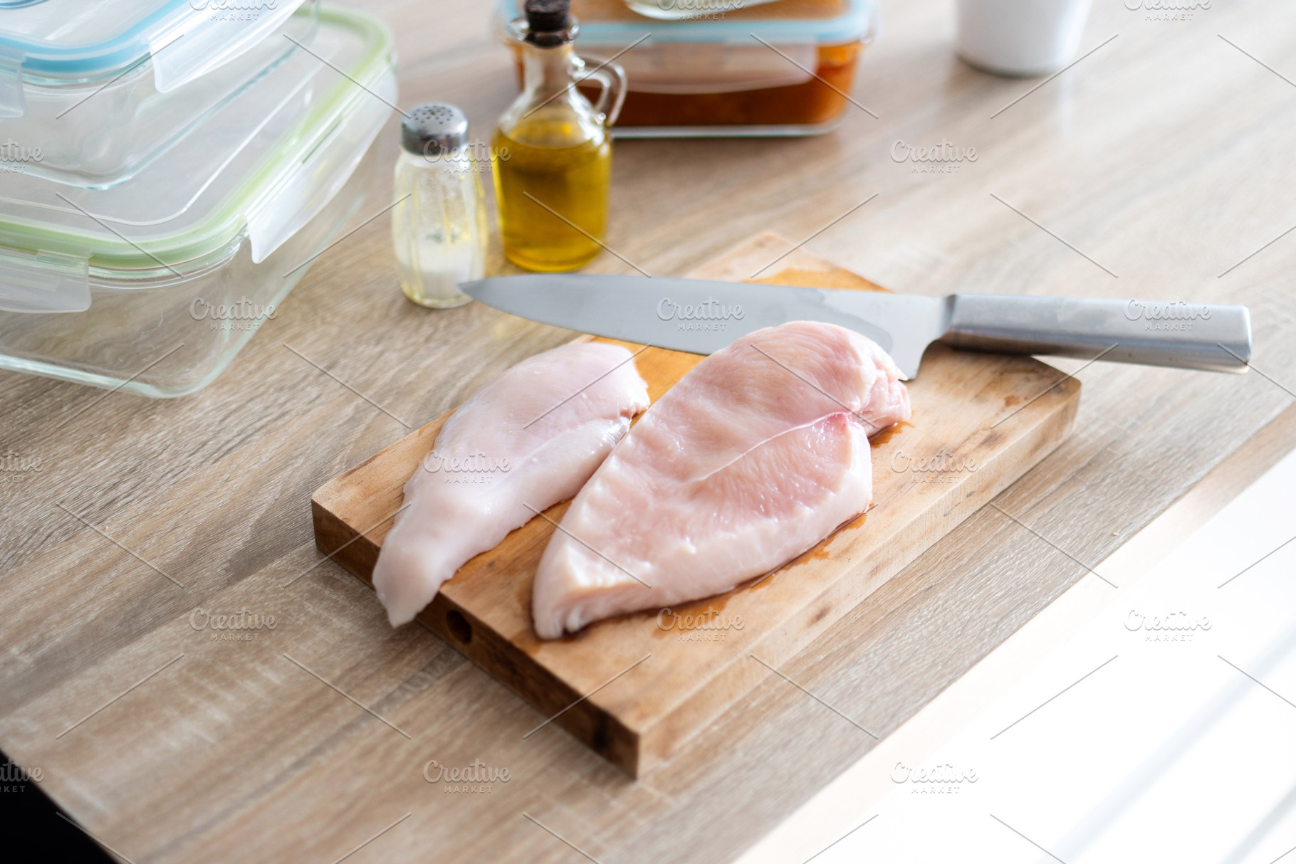 Raw Chicken Breasts with Knife on Wooden Cutting Board, a Food & Drink Photo by etorres69