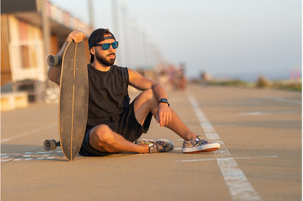 A cool guy sitting on a road with a, a Sports & Recreation Photo by Barcelona_dreams