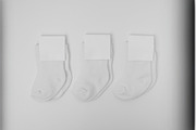Minimalist Baby Socks Mockup, a Bottom Mockup by The Marco (Thumbnail 2 of 3)