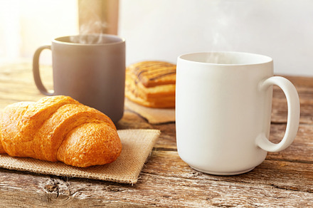 Steaming mugs and pastries creating a cozy breakfast atmosphere on a rustic woo, a Food & Drink Photo by Antonio Gravante Market