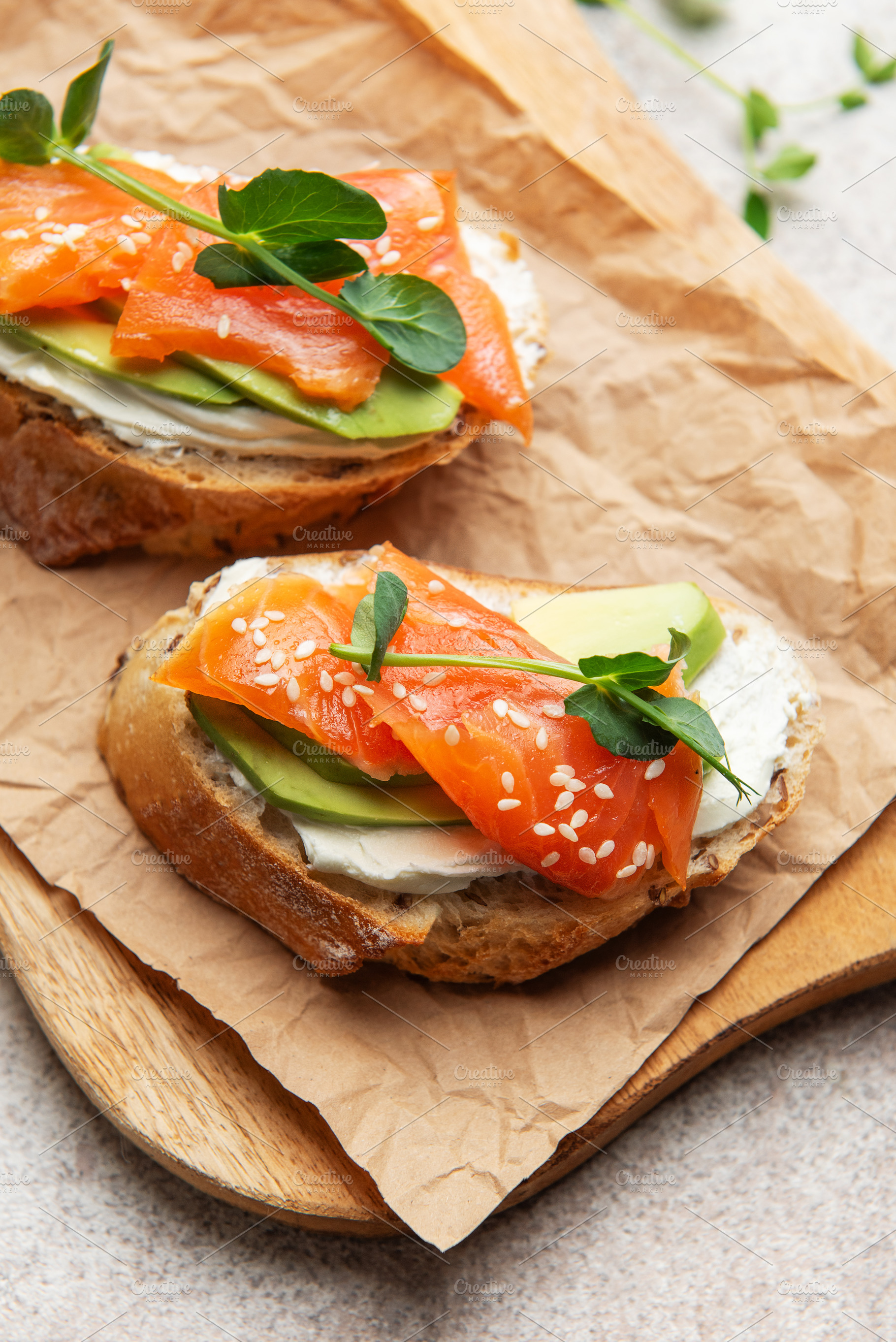 Salmon avocado toast with cream cheese and greens, a Food & Drink Photo by Olena Rudo
