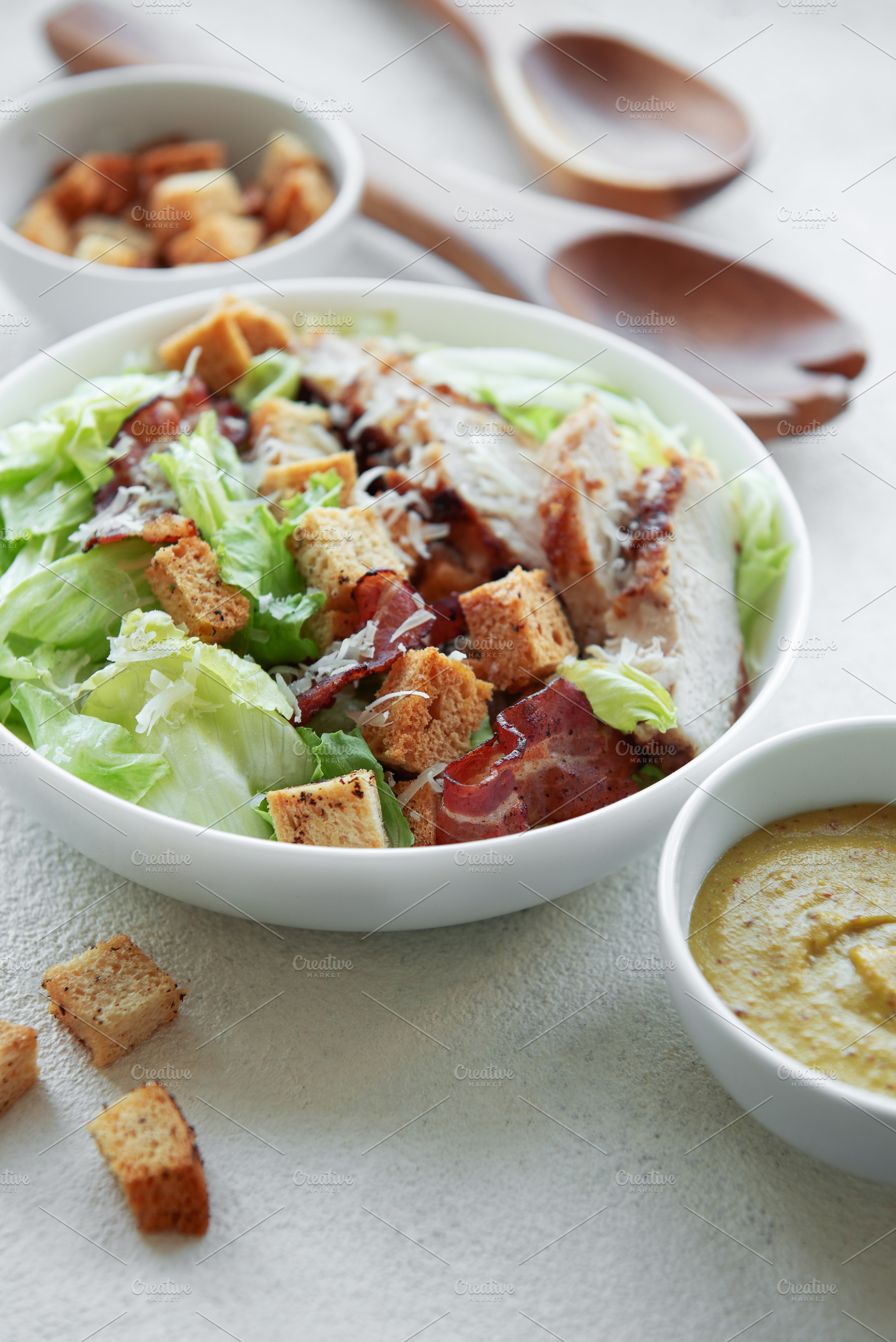 A bowl  of  Caesar salad, a Photo by Olena Rudo