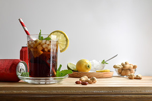 Refreshing carbonated cola drink on table with white isolated ba, a Food & Drink Photo by Davizro's Market
