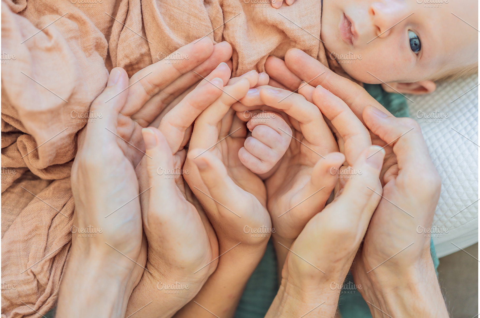 Newborn tiny hand surrounded by, a Person Photo by Elizaveta Galitskaya