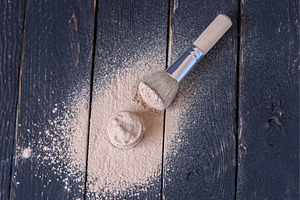 A jar of cosmetics with scattered, a Beauty & Fashion Photo by Stockphoto by vzwer