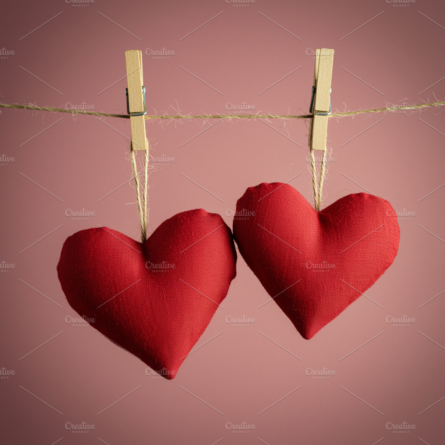 Two Red Fabric Hearts on Clothesline, a Photo by IrinaCzaran