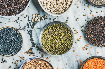 Various raw uncooked grains, beans, a Food & Drink Photo by Foxys