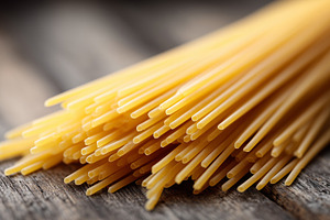 Uncooked spaghetti pasta on a rustic, a Food & Drink Photo by MistyDay