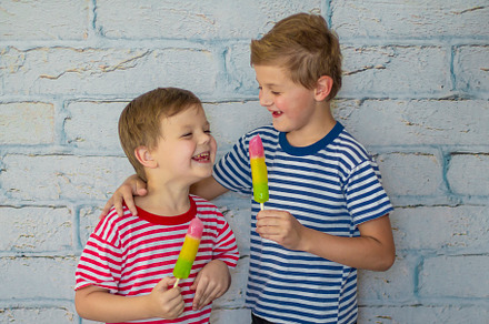 smiling boys are eating ice cream, a Person Photo by Anno Urbis