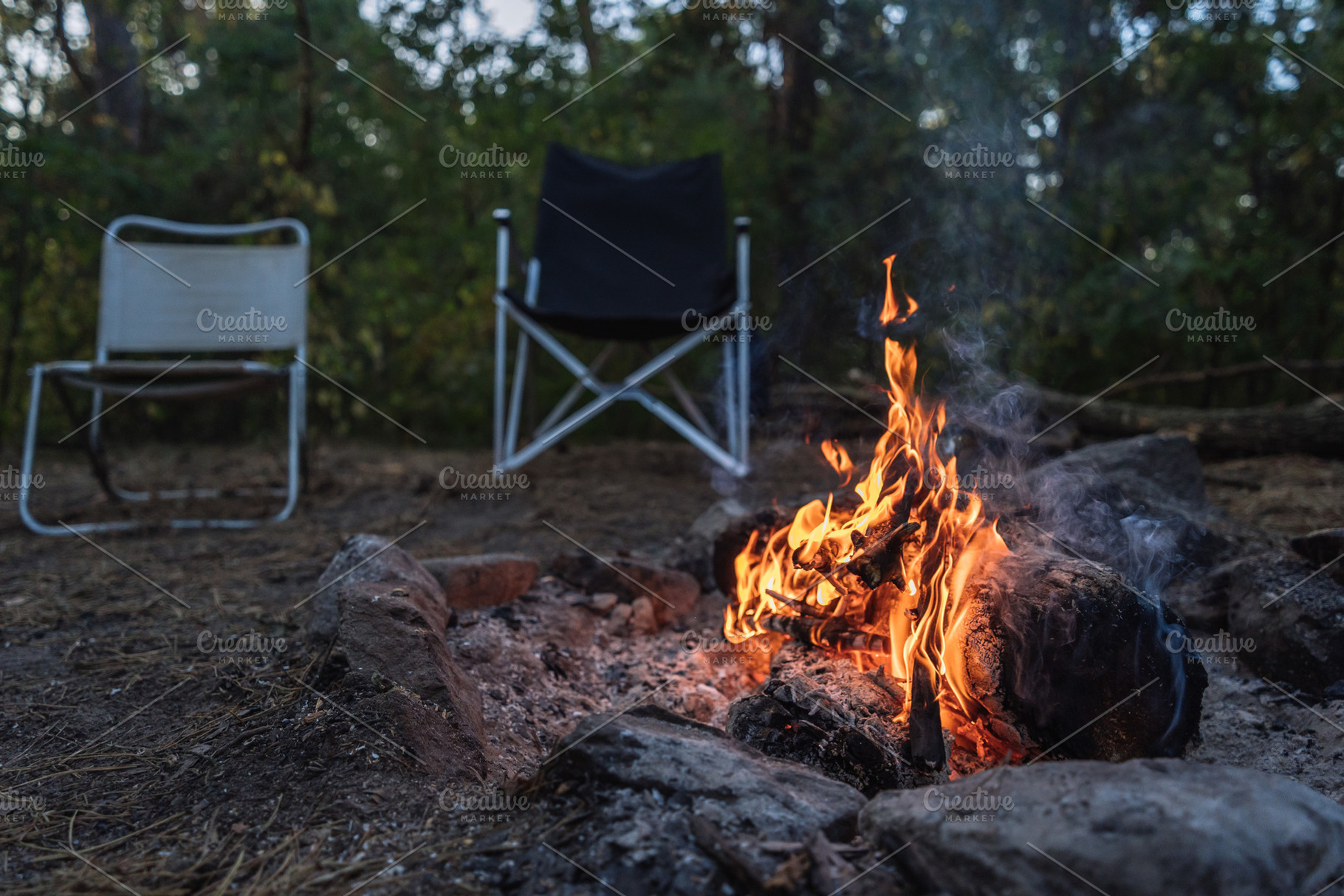 Campfire Burning at Forest Campsite with Empty Chairs, a Nature Photo by Red Hot Chili Pepper Shop