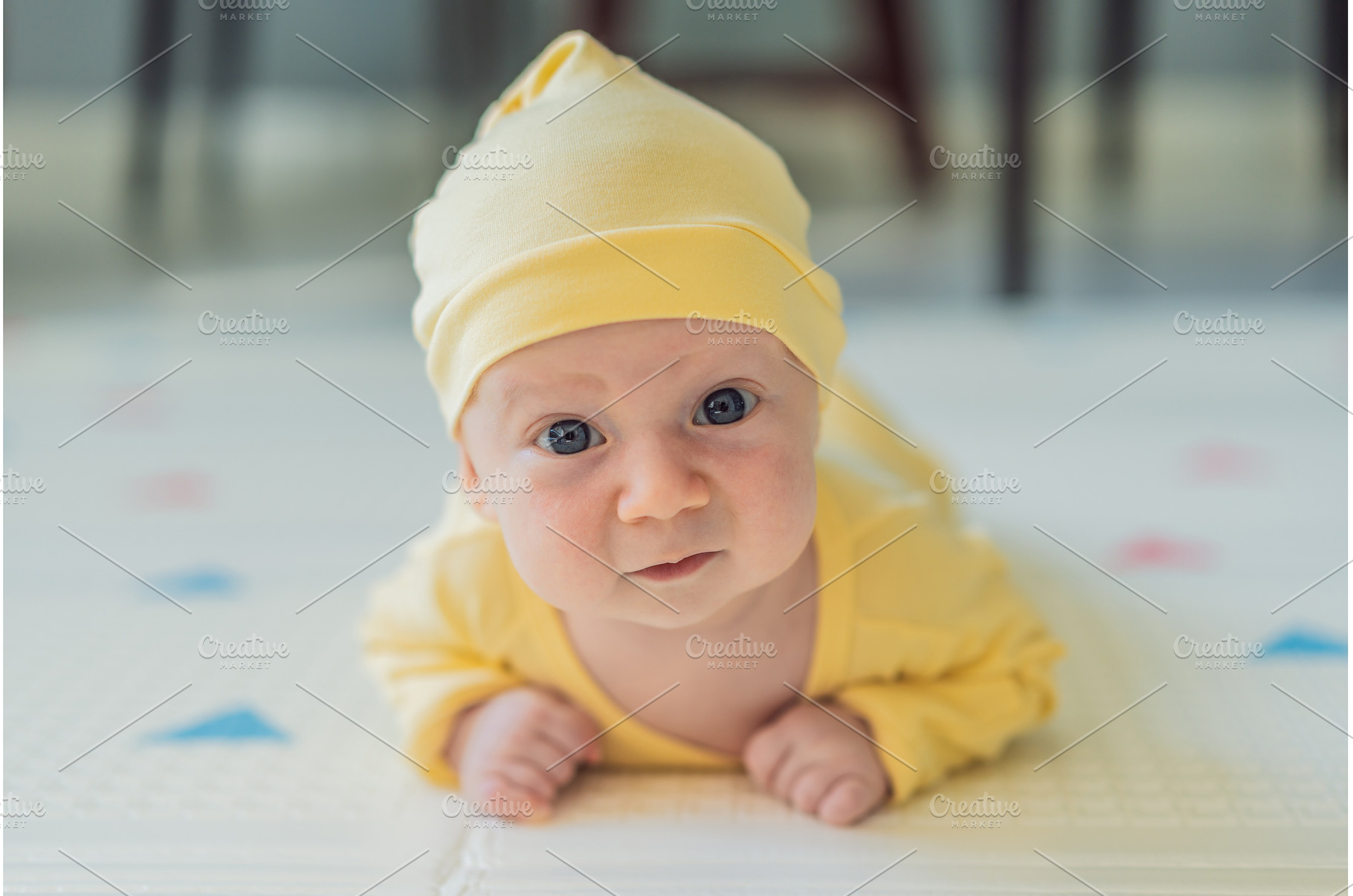 One-month-old baby lying on tummy, a Person Photo by Elizaveta Galitskaya