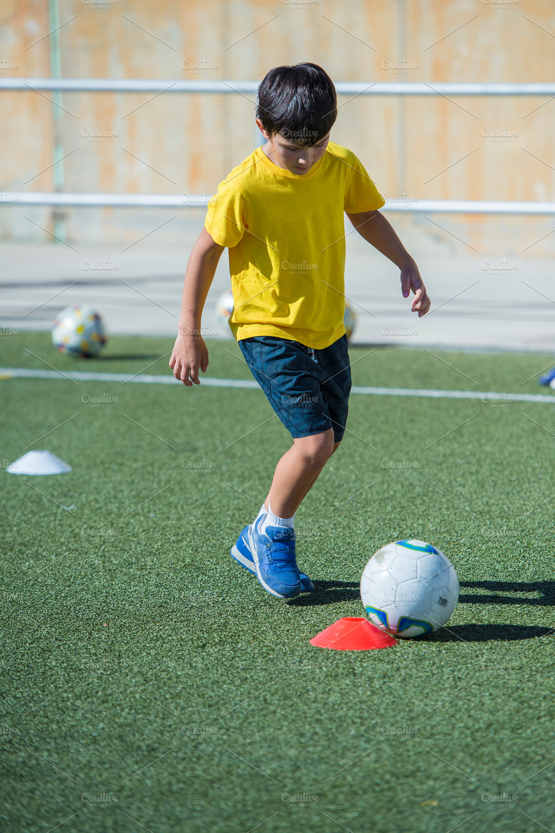 Young football player in a training containing football, soccer, and training, a Sports & Recreation Photo by Angel Simon Photography