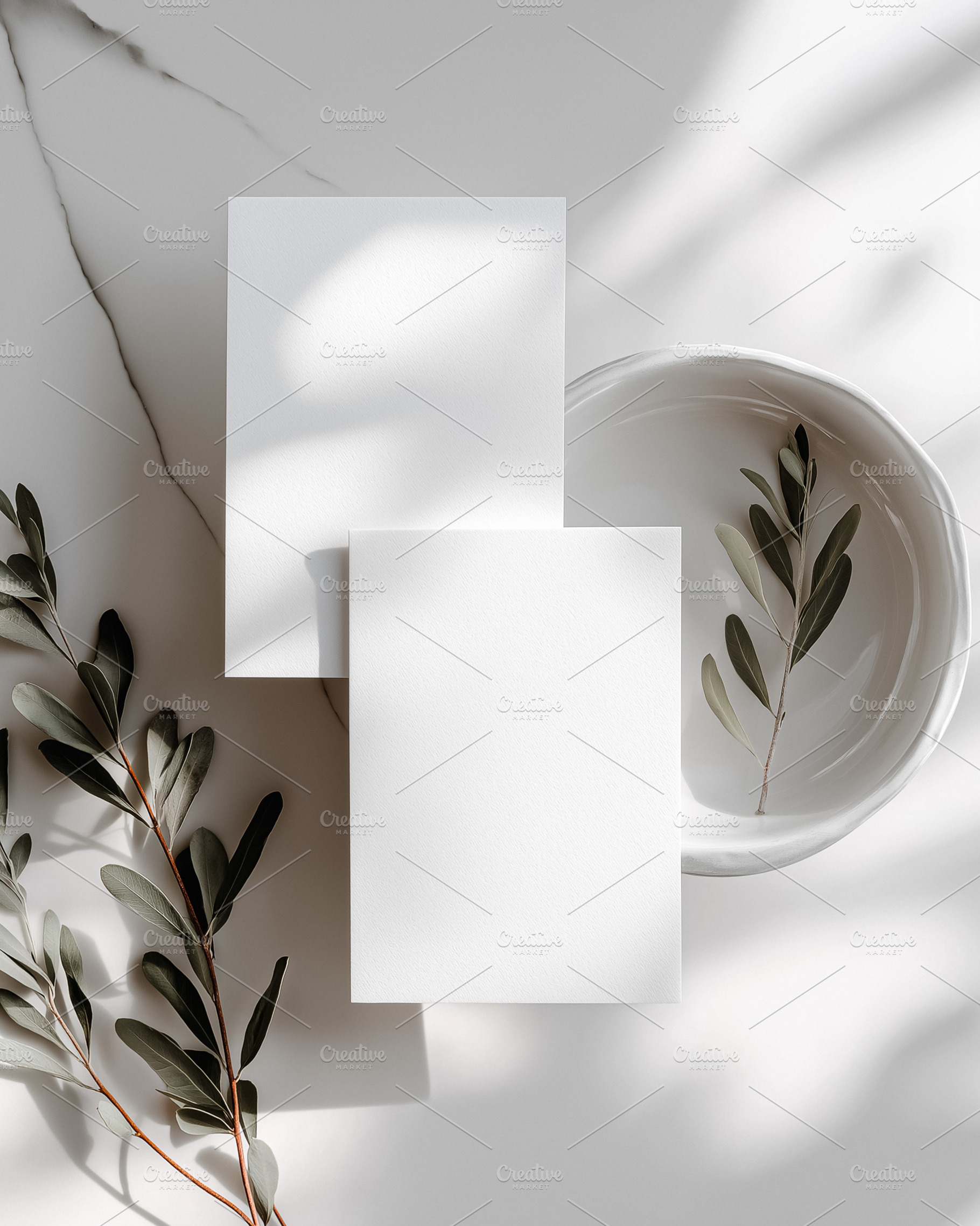 Blank white card mockup with olive branch, ceramic bowl, and dappled sunlight s, a Holiday Photo by Studio ANNA