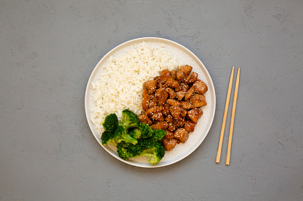 Homemade Teriyaki Chicken with Rice and Broccoli on a plate on a, a Food & Drink Photo by LiudmylaChuhunova